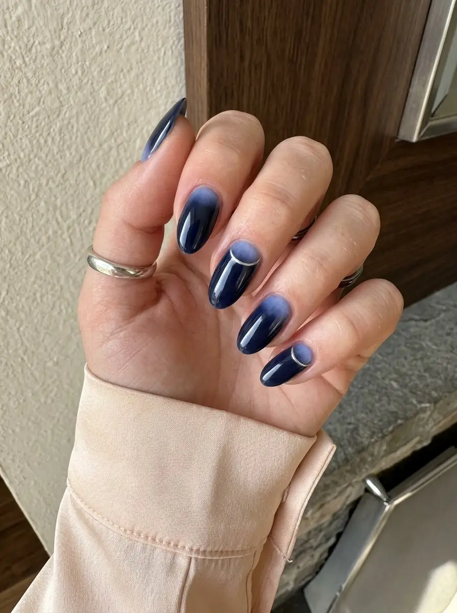 Midnight Blue Aura Nails With Silver Accent - Deep midnight navy almond nails with a smoky blue aura fade and delicate silver crescent accents
