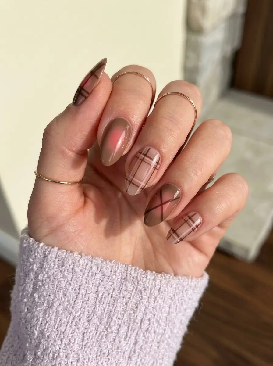 Taupe Plaid Nails With Pink Aura - Almond nails featuring fine taupe plaid line art and a diffused rosy pink aura glow