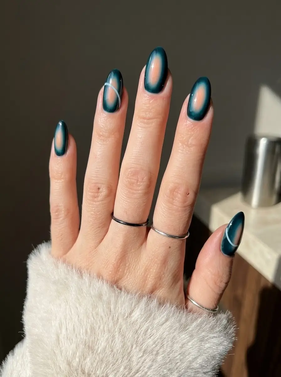 Deep Teal Aura Nails - Long almond nails with a glowing nude center, deep teal aura borders, and thin white line accents