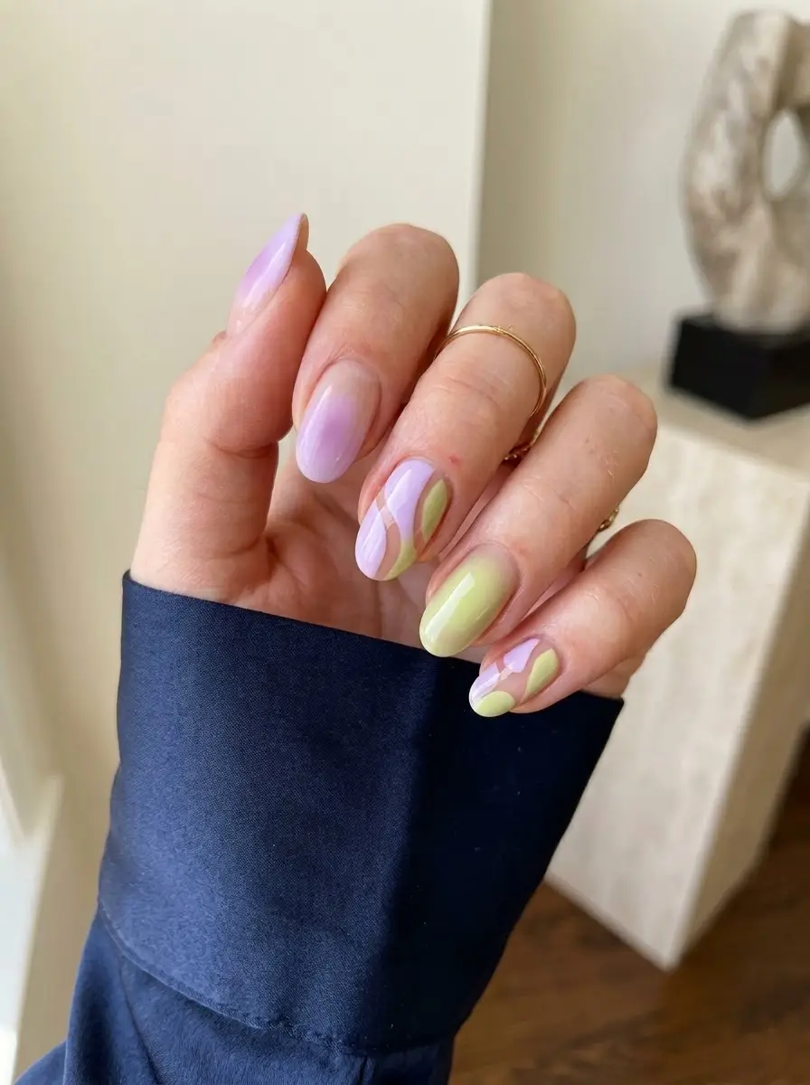 Lilac & Lime Abstract Aura Nails - Oval nails combining glossy lilac and creamy lime green in abstract curved color-block patterns