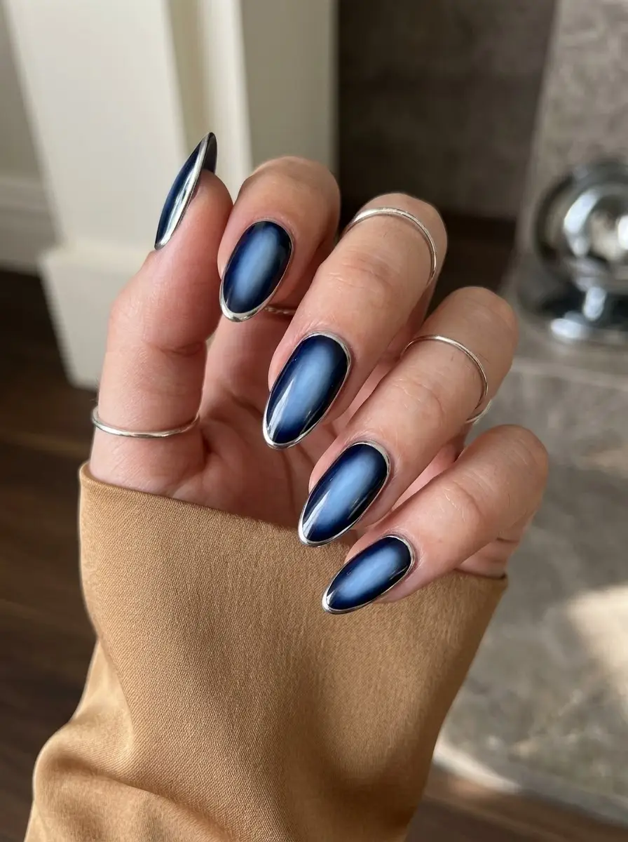Navy Aura Nails With Silver Outline - Midnight navy almond nails with a smoky blue aura center framed by a silver outline