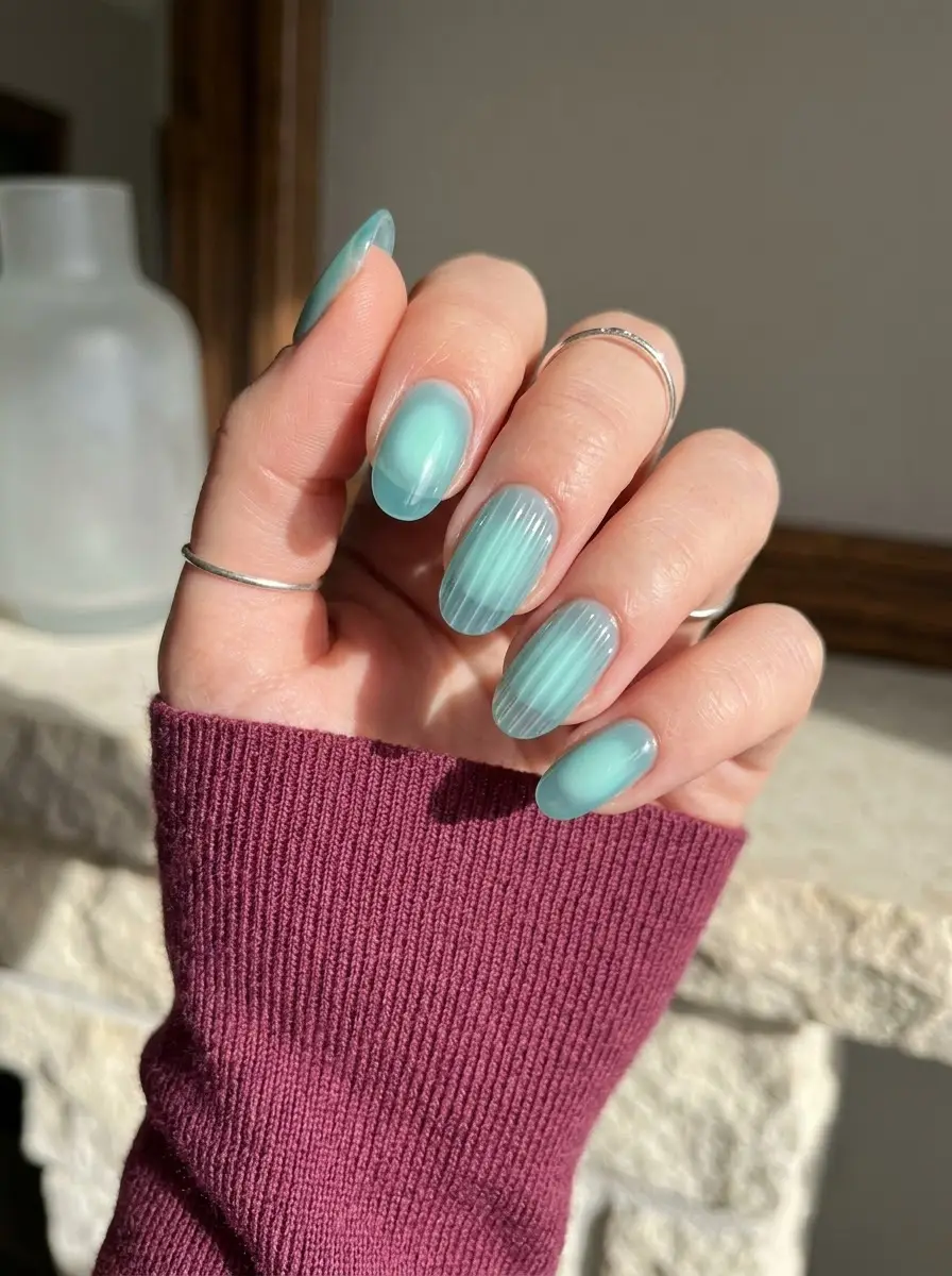 Aqua Aura Nails With Pinstripe Detail - Seafoam aqua oval nails blending pale aura centers with fine vertical pinstripes
