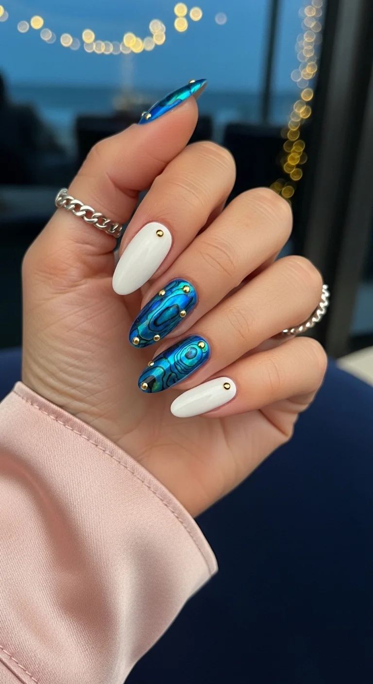 Abalone shell foil nails with white accents and gold studs