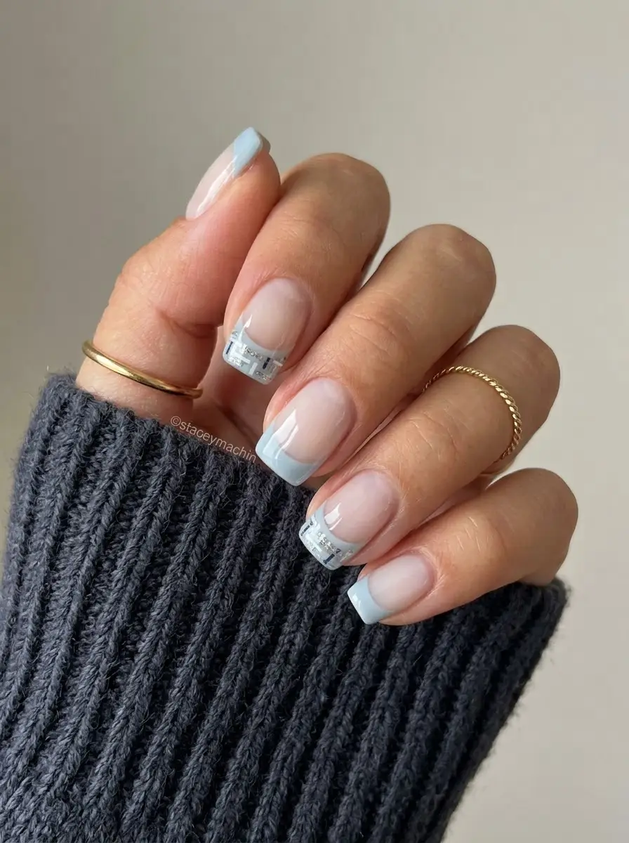 Icy Blue French Christmas Nails With Silver Details - Sheer milky-pink short square nails with powder-blue French tips and silver glitter blocks