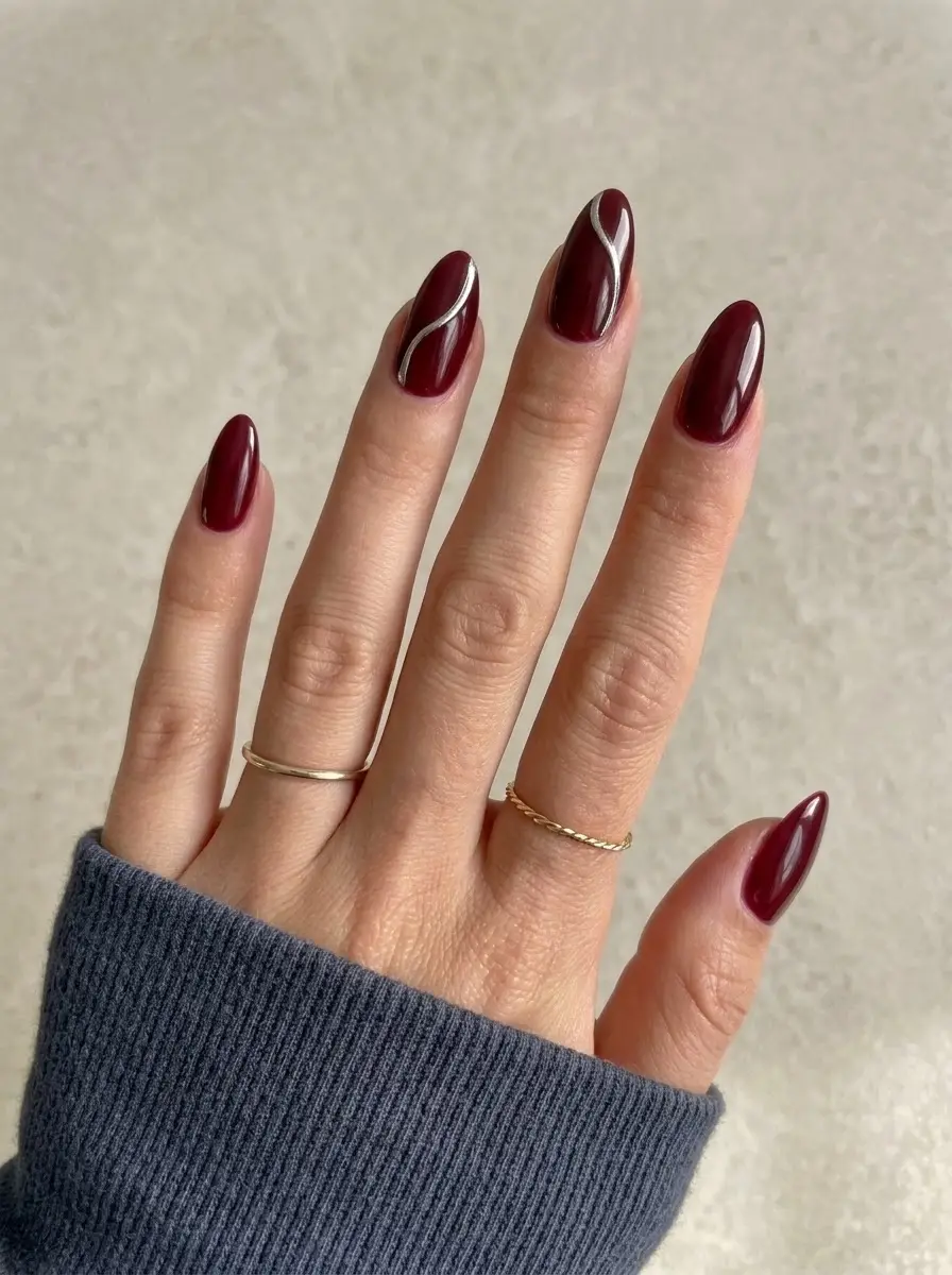 Deep Red Almond Nails with Silver Wave Lines