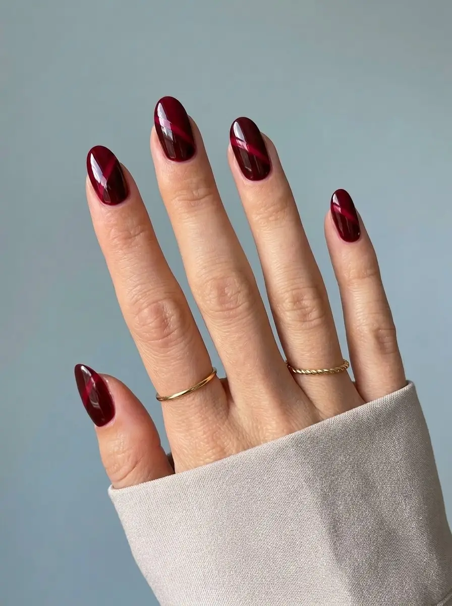 Glossy Deep Red Nails with Diagonal Crimson Stripes