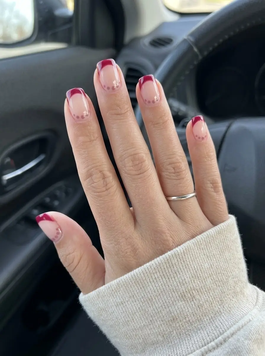 Deep Red French Tips with Delicate Dotted Accents