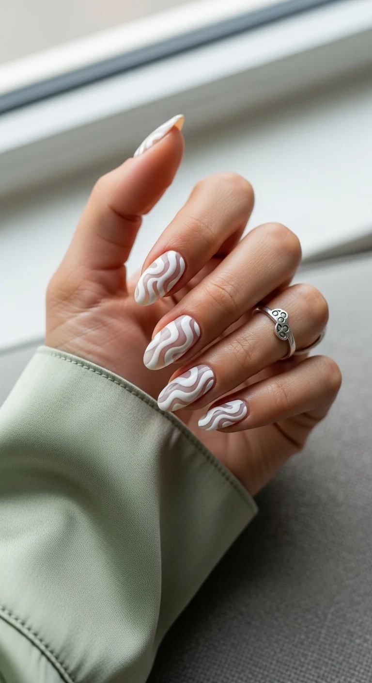 Clear and white nails with milky white swirls.