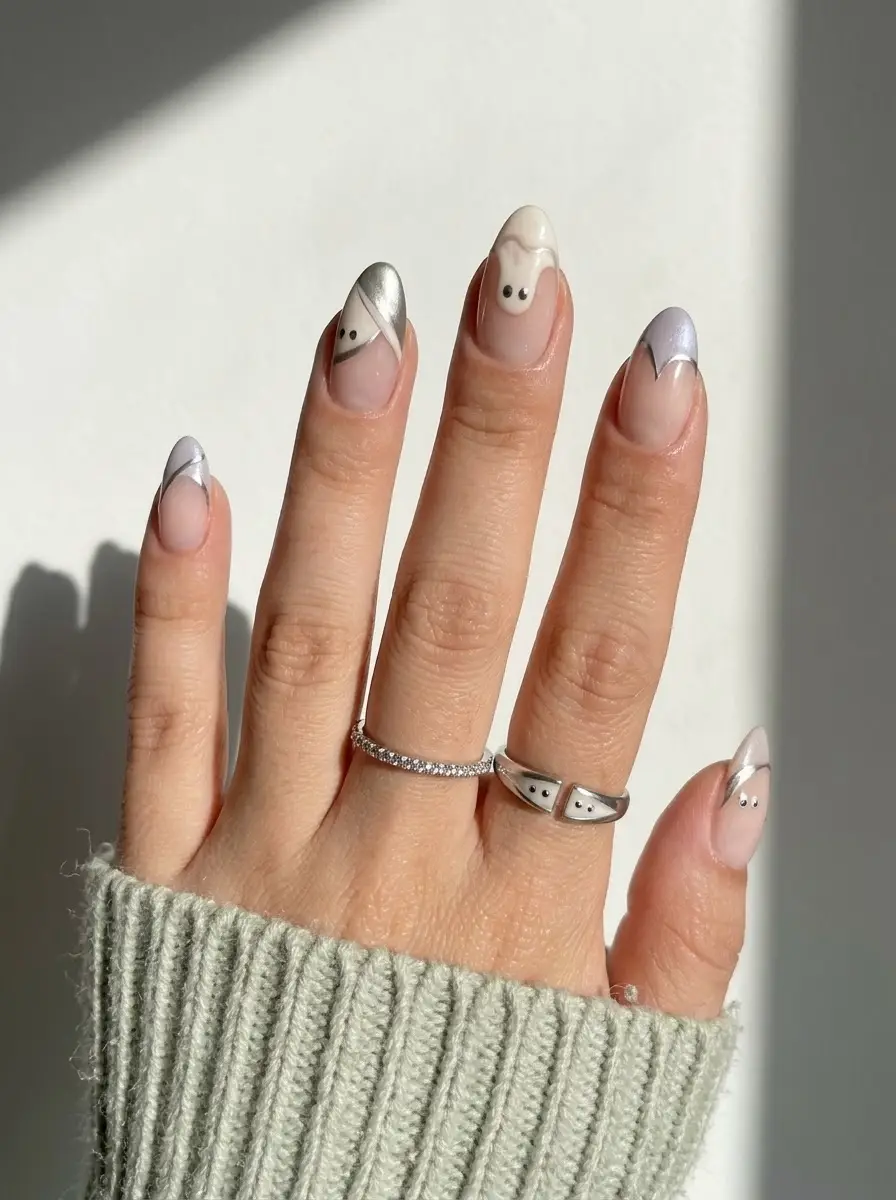Silver French Tip Ghost Nails - Soft nude almond nails with metallic silver and lilac French tips peeking with ghosts