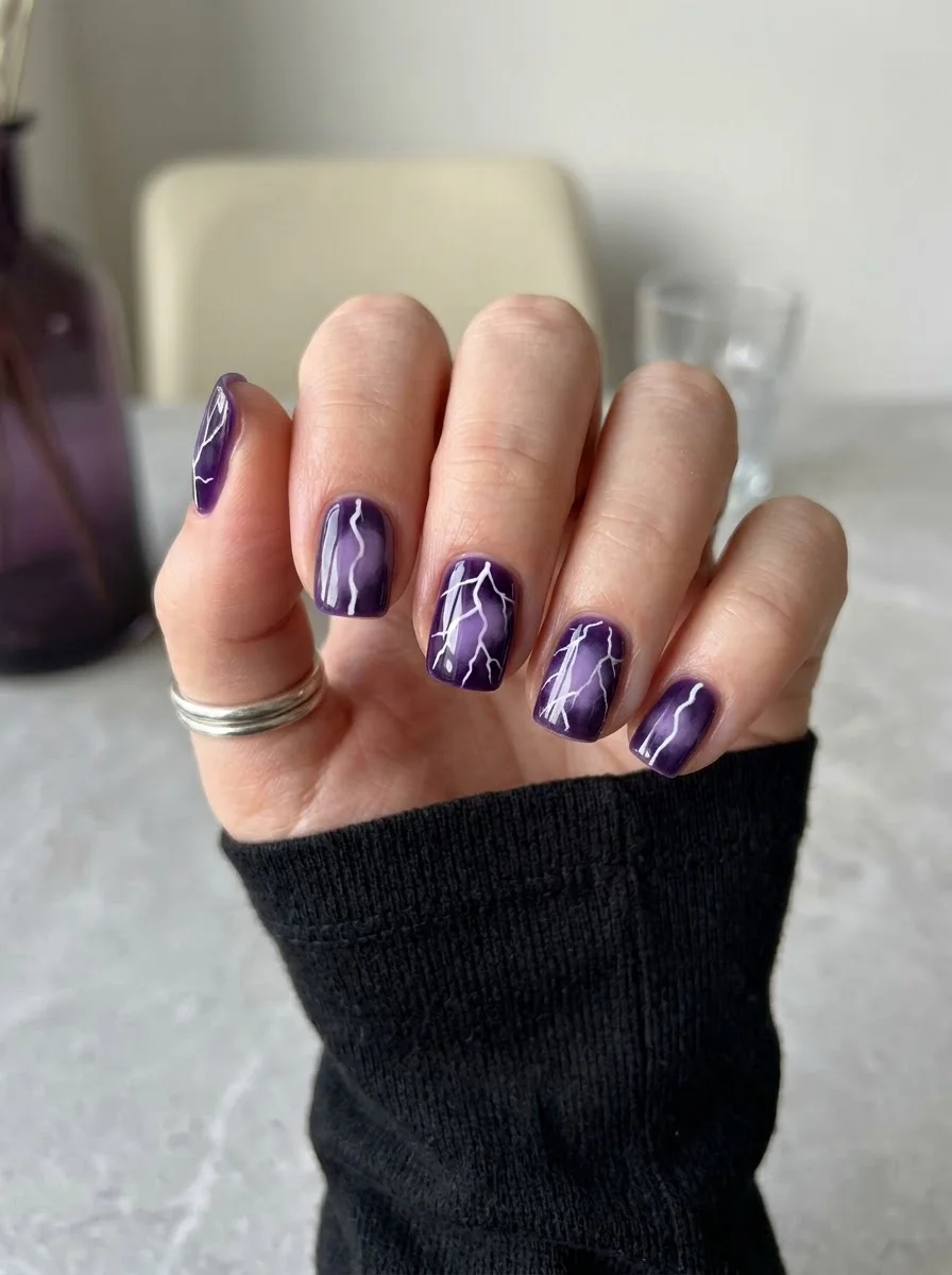 Purple Lightning Nails - Glossy deep purple short nails with sharp white lightning streak artwork