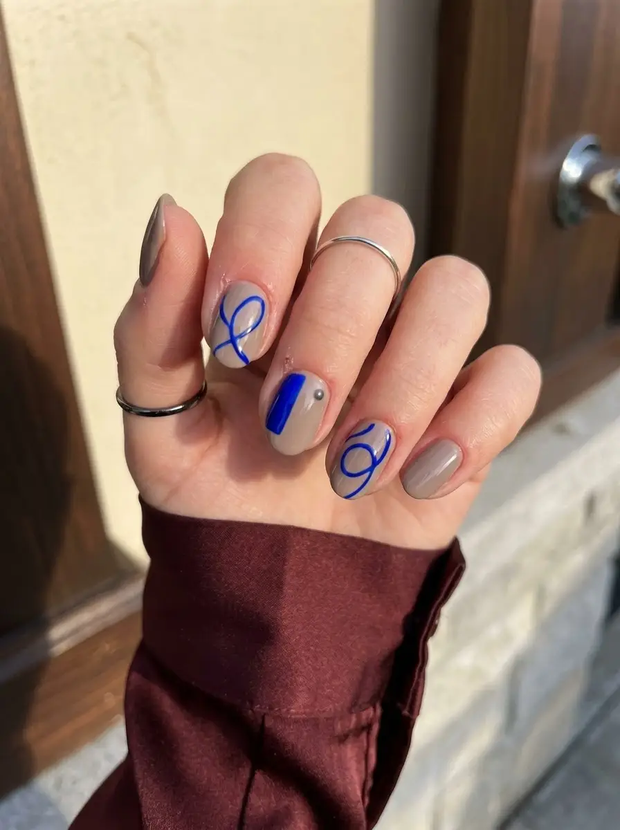 Greige and Cobalt Swirl Nails