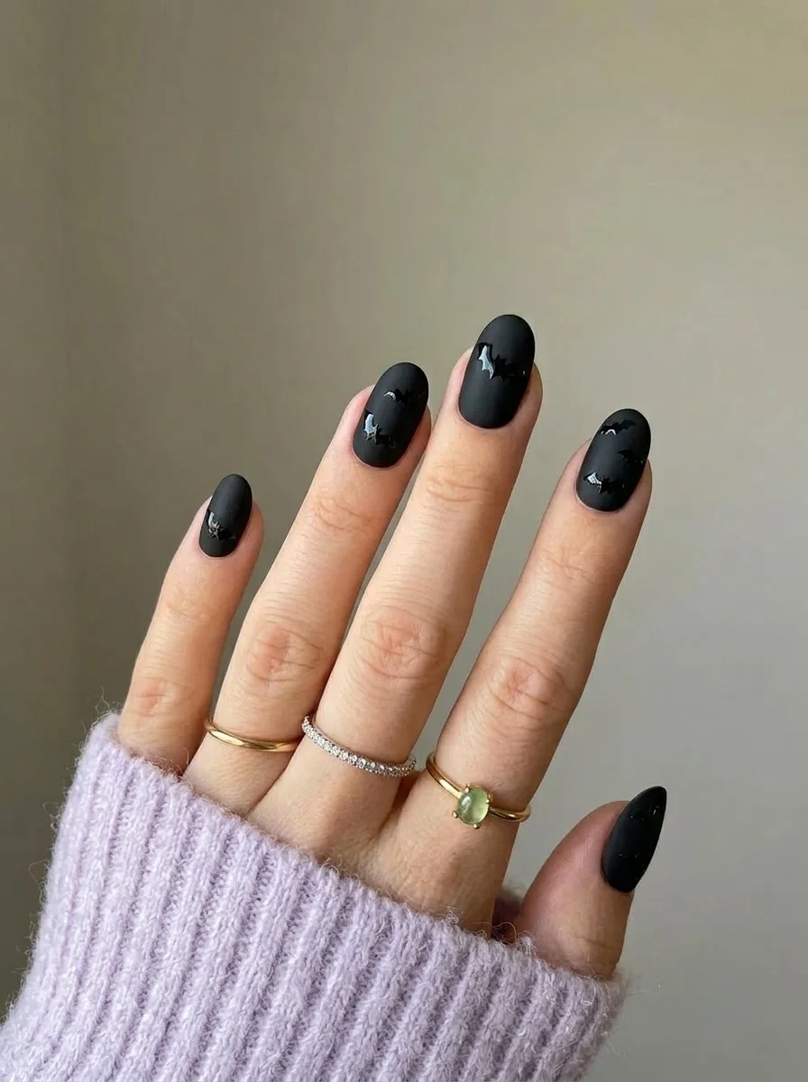 Matte Black with Glossy Bats - Matte black nails with glossy black bat silhouettes